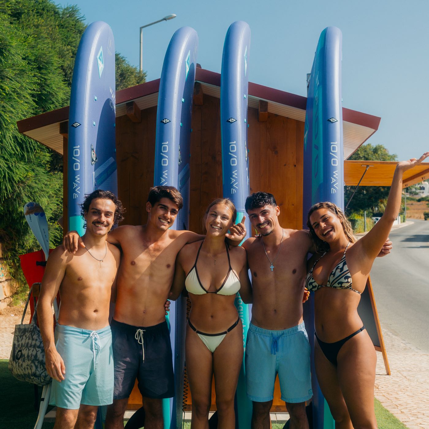 BlueWave Algarve team and guests posing with paddleboards